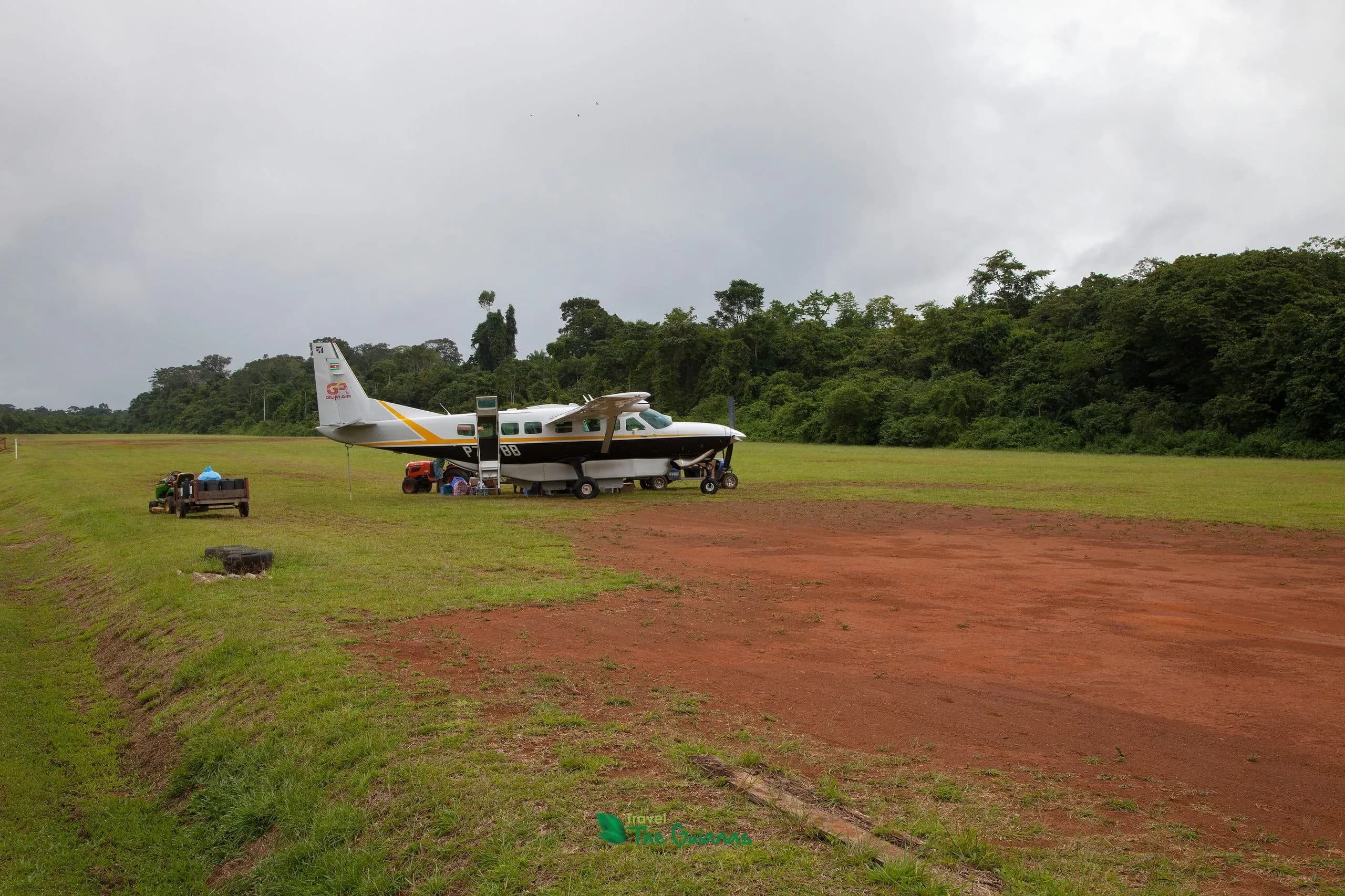 Small aircraft on a jungle airstrip in Suriname